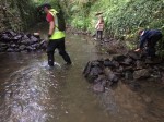 Gary, Sophie and Tom hard at work shifting rocks.